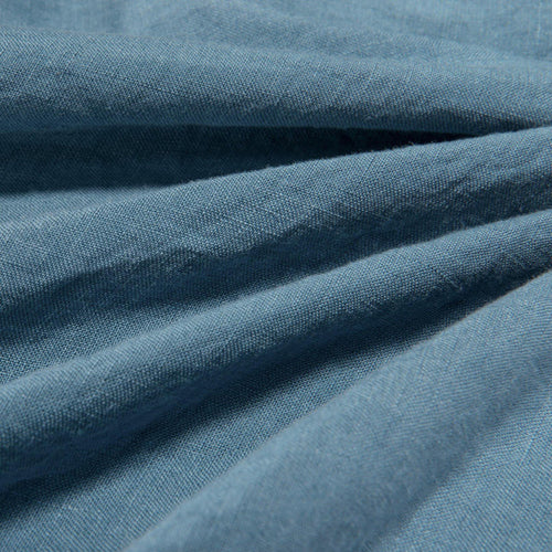 Close-up of aruba blue linen fabric texture showing natural weave