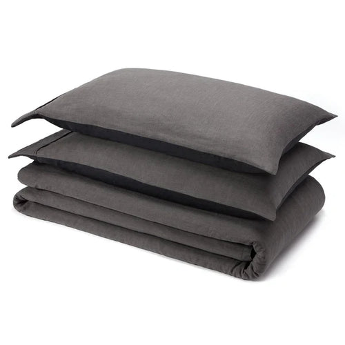 Charcoal linen sheet set folded with pillowcase on white background